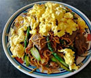 A beautifully arranged plate of noodles and meat, exemplifying the best in Indian and Nepali catering services.