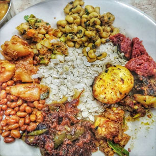 A colorful dish of beans, rice, and various ingredients, representing the best of Indian and Nepali cuisine.